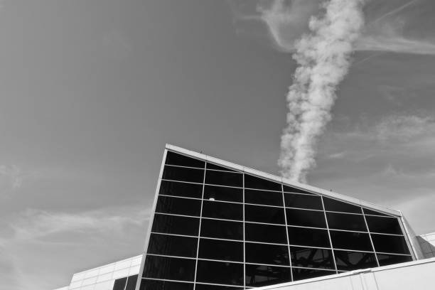 Architecture of a building. High building. Sky and clouds. Black and white photograph.