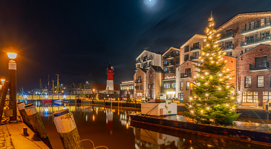 View of of festive lighting and Christmas romantic atmosphere in the Büsum at night. Nighttime view of Büsum at Christmas time. Maritime Christmas city.
