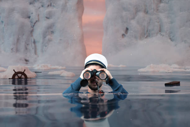 istock shipwrecked helmsman standing underwater and watching with binoculars the iceberg in the high seas 1359231386