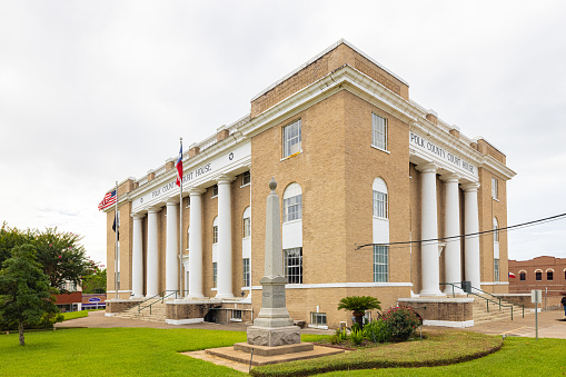 Livingston, Texas, USA - June 28, 2021: The Polk County Courthouse and its confederate memorial