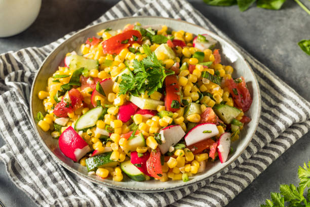 Healthy Homemade Sweet Corn Salad Healthy Homemade Sweet Corn Salad with Tomato and Cucumber corn salad stock pictures, royalty-free photos & images