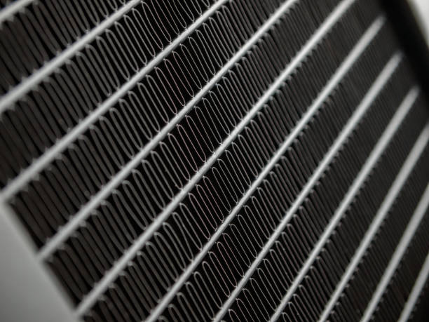radiator device for heat dissipation in the air by radiation and convection, air heat exchanger, grid close-up, macro, radiator cooling system stock photo