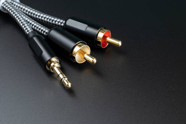 istock White and red audio connectors on black background. White-red audio connectors on black background. 1359238919