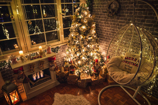 istock Decorated Christmas Tree Near Fireplace at Home 1359242752
