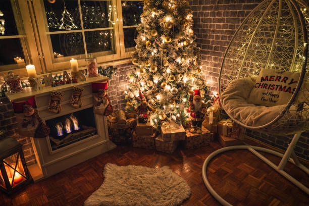 istock Decorated Christmas Tree Near Fireplace at Home 1359242757