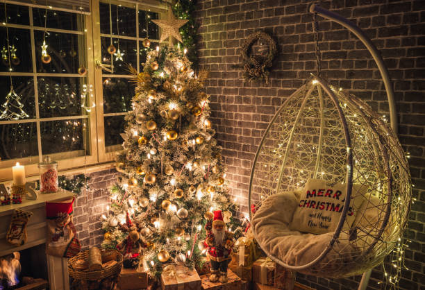 istock Decorated Christmas Tree Near Fireplace at Home 1359242768