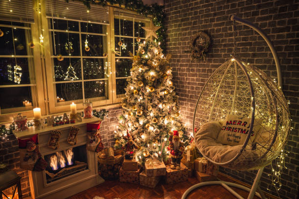 istock Decorated Christmas Tree Near Fireplace at Home 1359242769