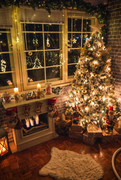 istock Decorated Christmas Tree Near Fireplace at Home 1359242770