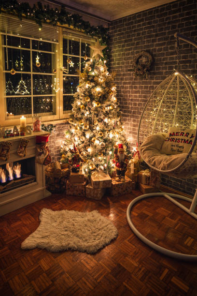 istock Decorated Christmas Tree Near Fireplace at Home 1359242778