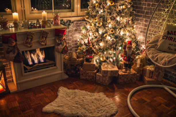 istock Decorated Christmas Tree Near Fireplace at Home 1359242787