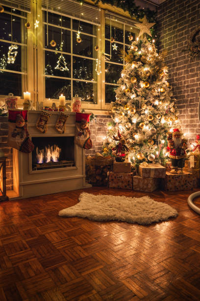 istock Decorated Christmas Tree Near Fireplace at Home 1359242800