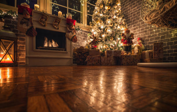 istock Decorated Christmas Tree Near Fireplace at Home 1359242806