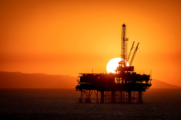 istock Offshore oil platform at dusk 1359245099