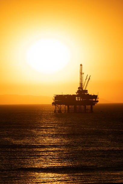 istock Offshore oil platform at dusk 1359245116