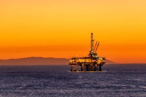istock Offshore oil platform at dusk 1359245120