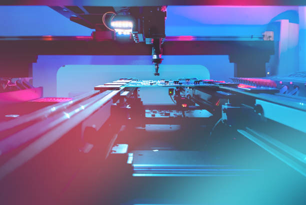 istock SMT Concept: Production of high-tech computer boards on an automatic SMT machine 1359245845