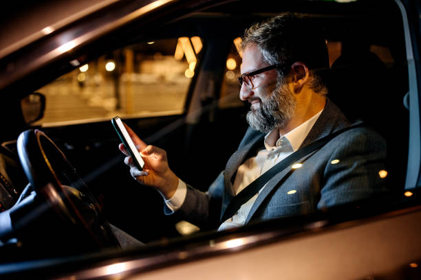 istock Businessman texting from his car 1359246283