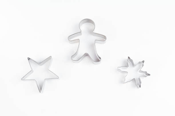istock Various metal forms for baking Christmas almond or gingerbread on a light background. Festive background. New Year concept. Copy space. Christmas card. 1359248196