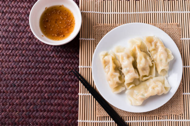 istock Steamed wonton dumpling stuffed with minced pork Asian food 1359252627