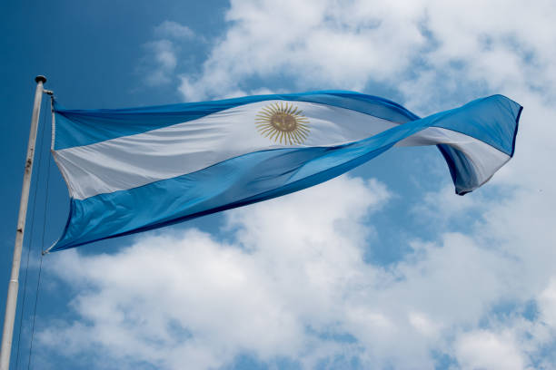 istock Argentine flag in a cloudy sky 1359255463