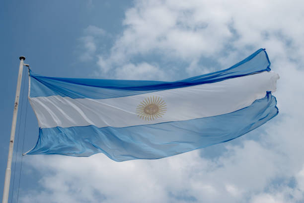 istock Argentine flag in a cloudy sky 1359255480