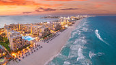 Cancun beach during with red sunset and blue hour