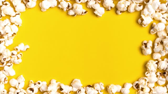 Stop motion with popcorn frame on yellow background