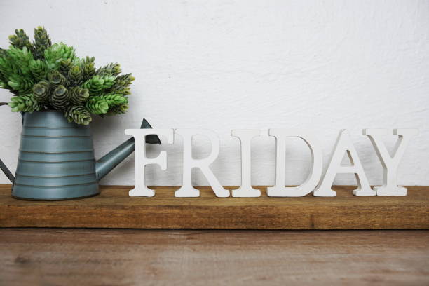 istock Friday alphabet letters on wooden background 1359260769