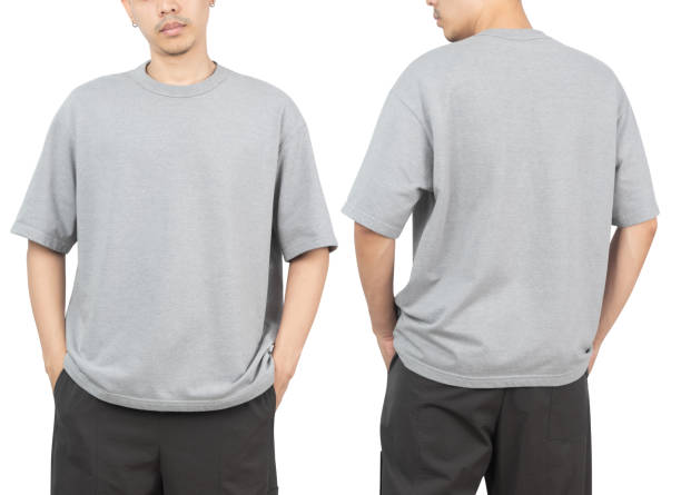 istock Young man in grey oversize t-shirt mockup front and back used as design template, isolated on white background with clipping path 1359263414