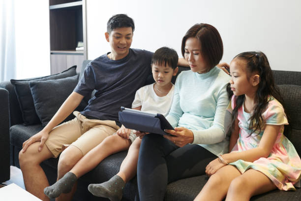 istock Family resting in sofa 1359266240