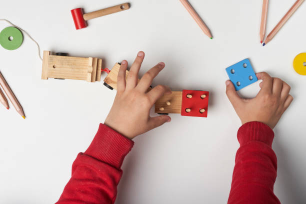 istock A little boy playing wooden toys 1359268976