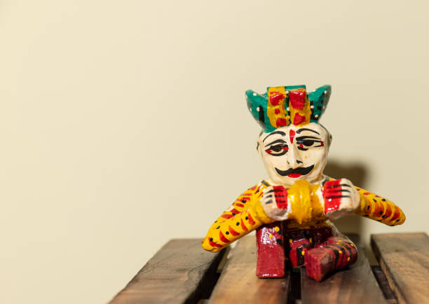 Handmade colorful wooden rajasthani souvenir Handmade colorful wooden rajasthani musician souvenir with plain background. doll puppet indian culture small stock pictures, royalty-free photos & images