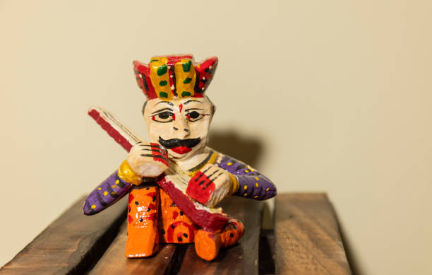 Handmade colorful wooden rajasthani souvenir Handmade colorful wooden rajasthani musician souvenir with plain background. doll puppet indian culture small stock pictures, royalty-free photos & images