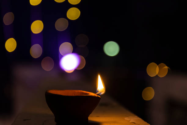 istock Diya lamp with colorful background during diwali 1359272498