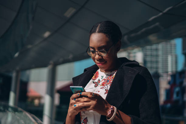 istock Businesswoman is using a phone on a work break 1359274225