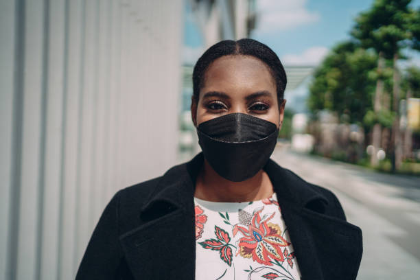 istock Woman smiling behind the mask 1359274823