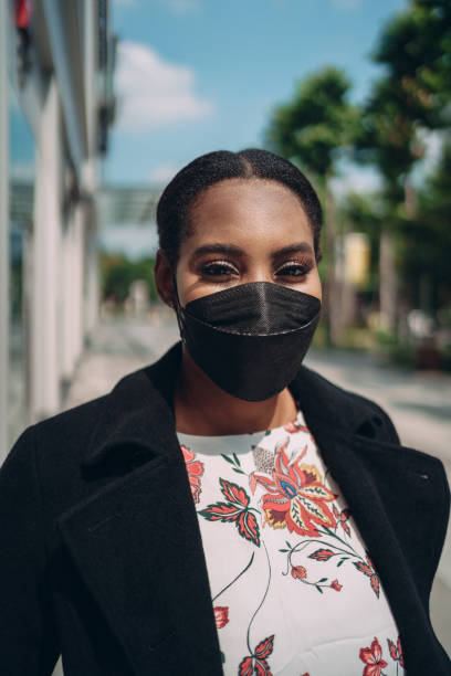 istock Woman smiling behind the mask 1359274824