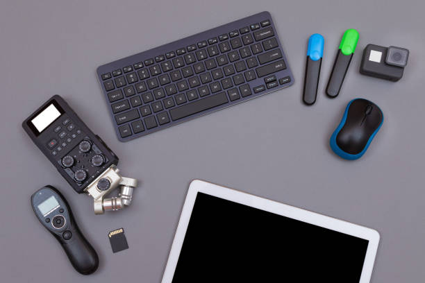 istock Digital Gadgets on Grey Table - Video Blogger's Workplace 1359275913
