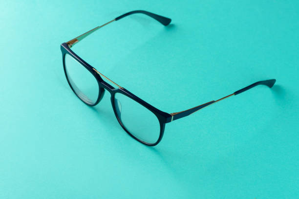 istock Trendy eyeglasses on light green background 1359276028