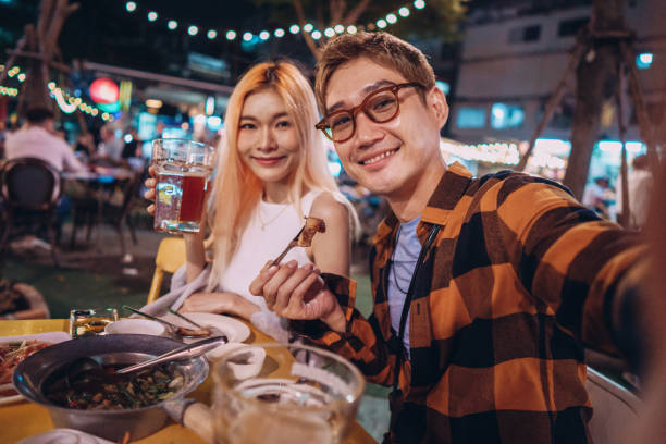 istock Friends taking selfies in a night out 1359276785
