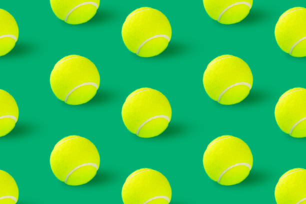 istock Tennis balls on green background recorded in studio 1359276844