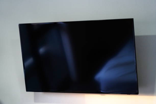 istock Modern tv hanging on the wall. 1359277604