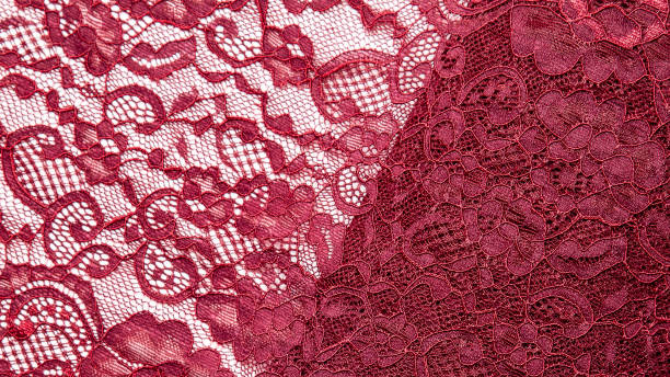 istock Texture, cloth, background. Red, burgundy lace fabric with a pattern 1359282853