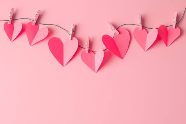 istock Paper hearts on a clothesline with space for copy 1359283515