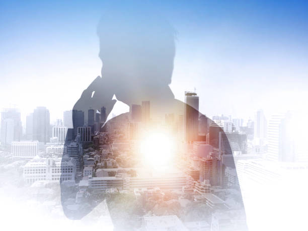istock Businessmen. Read newspaper abstract city background 1359291140