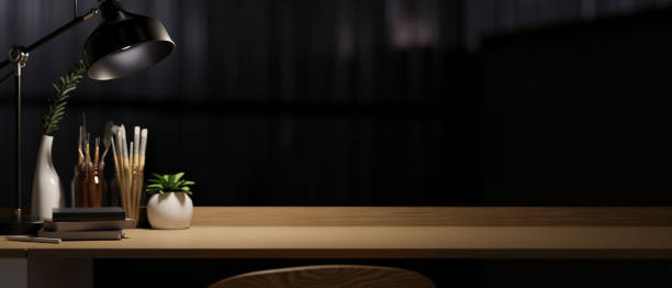 istock Modern dark workspace with painting tools and copy space on wooden desk 1359295067