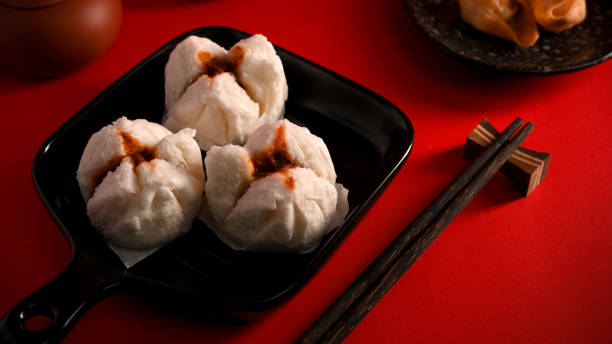 istock Steamed red minced pork buns. Chinese appetiser concept 1359295139