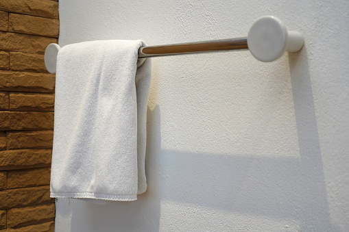 Towel drying on the rail in bathroom