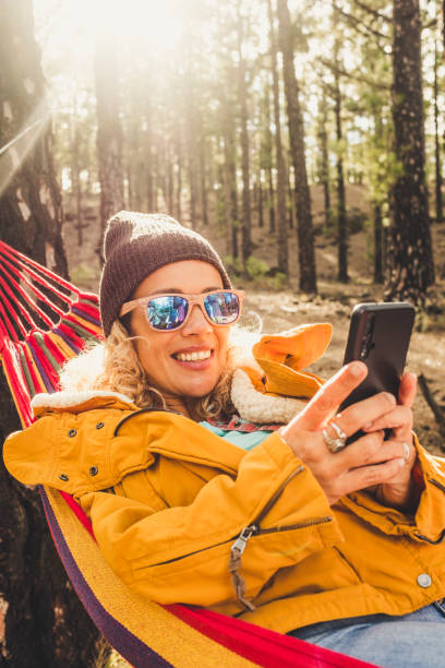 istock Portrait Of Smiling Young Man Using Mobile Phone 1359295477