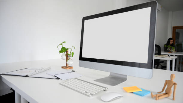 istock Modern office desk with desktop computer and office supplies. 1359296355
